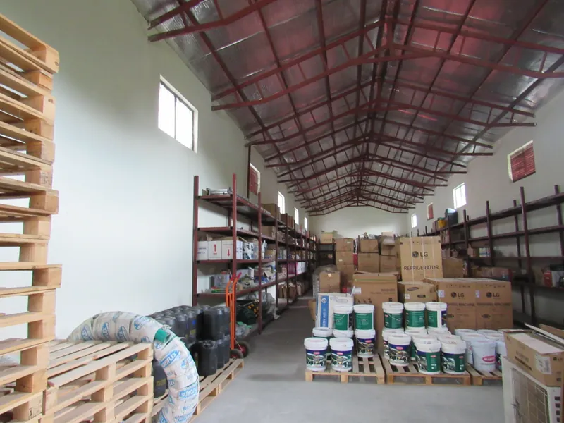 Store shelves with boxed supplies – Tibleino General Trading