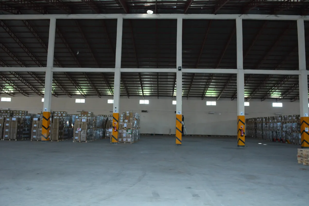 Warehouse interior with stock along the walls – Tibleino General Trading
