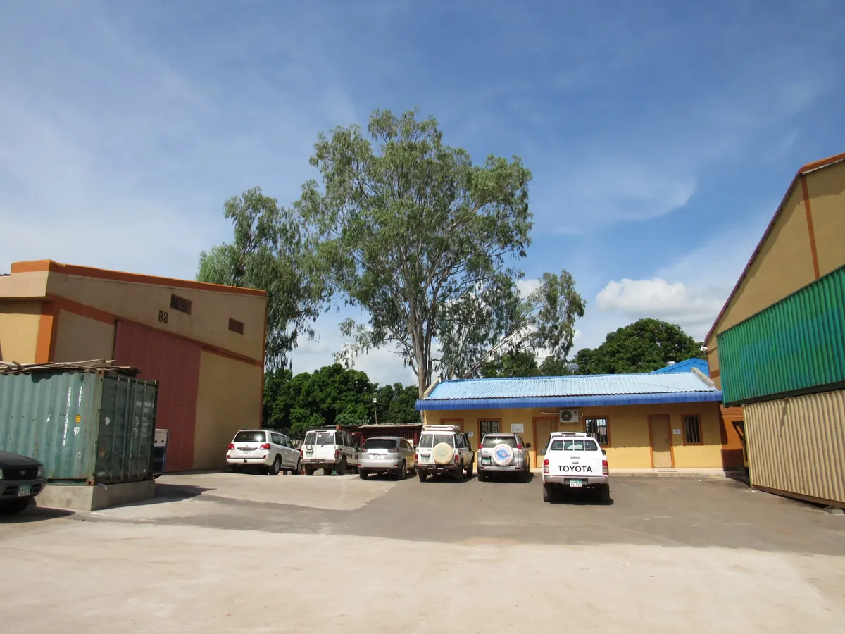 Tibleino General Trading yard with containers and vehicles, Juba